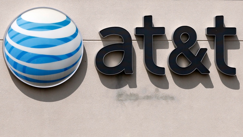 FILE In this May 14, 2014 file photo, an AT&T logo on a store in Dedham, Mass. (AP Photo/Steven Senne, File)