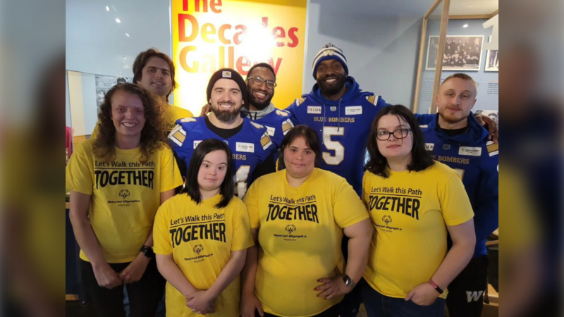 Team Manitoba athletes pose for a photo with Winnipeg Blue Bombers at a send-off party on Feb. 21, 2024. (Source: Special Olympics Manitoba/Instagram)