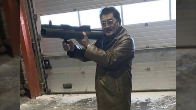 This image provided by the U.S. Attorney, Southern District of New York shows a photo from a complaint document filed by SDNY that shows Takeshi Ebisawa handling a rocket launcher. (U.S. Attorney, Southern District of New York via AP)