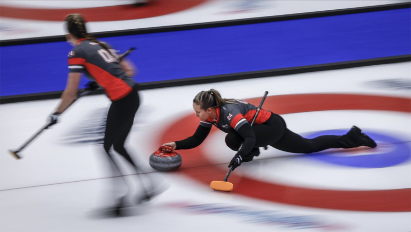 Team Ontario—Homan skip Rachel Homan, right, delivers a stone against Team British Columbia-Grandy at the Scotties Tournament of Hearts in Calgary, Wednesday, Feb. 21, 2024. THE CANADIAN PRESS/Jeff McIntosh