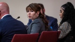 Hannah Gutierrez-Reed sits with her attorneys on trial for involuntary manslaughter and tampering with evidence. Thursday, February 22, 2024. (Eddie Moore/Santa Fe New Mexican via AP, Pool)