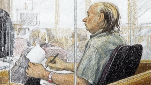 An artist's sketch shows accused serial killer Robert Pickton taking notes during the second day of his trial in B.C. Supreme Court in New Westminster, B.C., Tuesday January 31, 2006.  THE CANADIAN PRESS/Jane Wolsack
