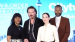 Cast members (left to right) Karen Robinson, Aden Young, Kathleen Munroe, and K.C. Collins pose for a photo at a press junket as they promote the television series "Law & Order Toronto: Criminal Intent" in Toronto on Tuesday, Feb. 20, 2024. THE CANADIAN PRESS/Chris Young