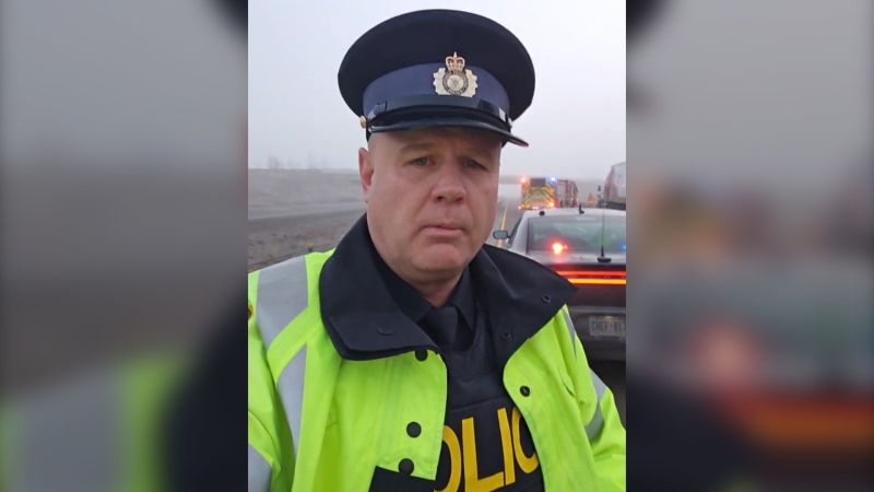OPP Const. Ed Sanchuck is seen at the scene of a crash on Highway 401 and Southminster Street, near London, Ont., on Feb. 23 2024. (Source: OPP West Region/X)