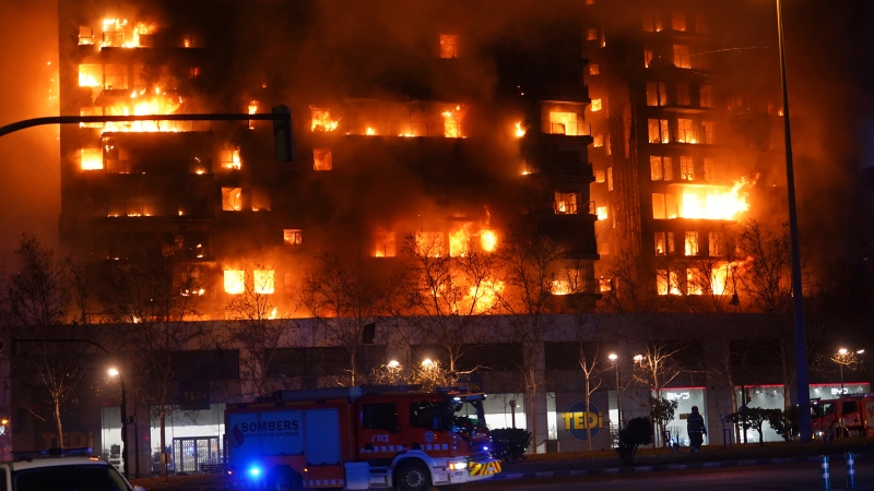 A housing block burns in Valencia, Spain, Thursday, Feb. 22, 2024. (AP Photo/Alberto Saiz)
