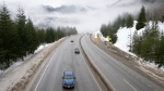 Vehicles are seen as they drive along the Coquihalla Highway Wednesday, January 19, 2022. THE CANADIAN PRESS/Jonathan Hayward