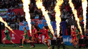 Pyrotechnics go off as Canada and Ireland players run onto the field before an HSBC Canada Sevens women's rugby match, in Vancouver, B.C., Sunday, March 5, 2023. THE CANADIAN PRESS/Darryl Dyck