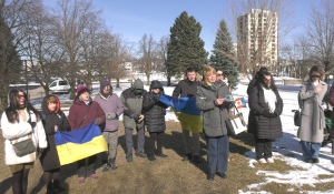 Members of the Ukrainian community gathered in front of Sault Ste. Marie City Hall on Friday to mark the second anniversary of the Russian invasion of Ukraine. (Mike McDonald/CTV News)