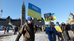 People take part in a demonstration in support of Ukraine on the second anniversary of Russia's invasion, on Parliament Hill in Ottawa on Saturday, Feb. 24, 2024. THE CANADIAN PRESS/Patrick Doyle
