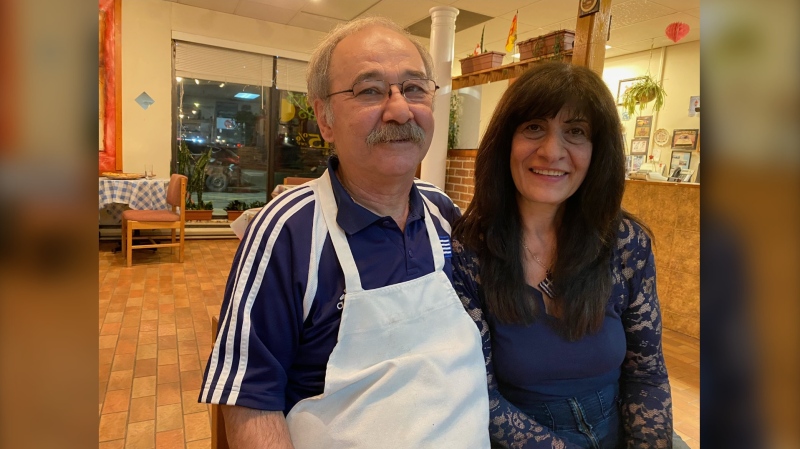 Mike Stefandis and his wife, Helen, smile for a photo in Bravo Pizzeria. (CTV/Derek Haggett)