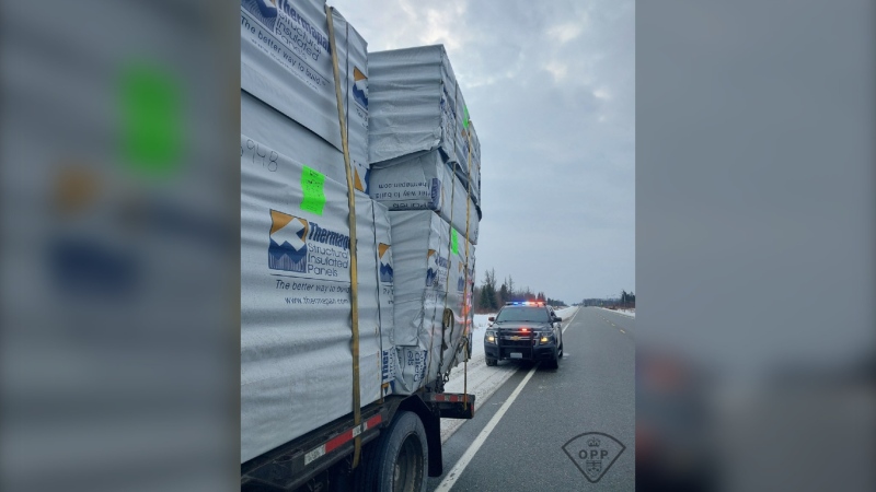After receiving multiple calls about a commercial motor vehicle travelling with an improper load Ontario Provincial Police stopped the transport truck on Highway 11 south of Cochrane, Ont. on Feb. 21, 2024. (Supplied/Ontario Provincial Police)