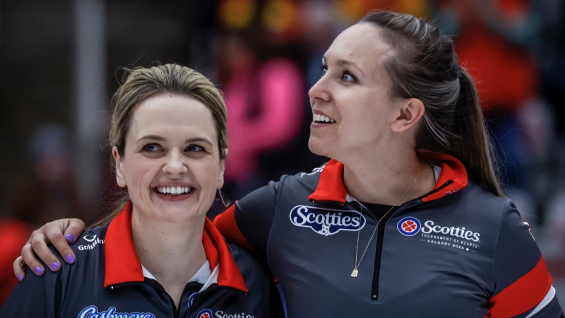 Team Ontario-Homan skip Rachel Homan, right, celebrates with vice-skip Tracy Fleury after defeating Team Manitoba-Jones in the final at the Scotties Tournament of Hearts in Calgary, Sunday, Feb. 25, 2024. THE CANADIAN PRESS/Jeff McIntosh