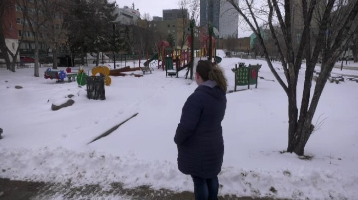 Lois Coward looks at the playground in Central Park where she has to check for dangerous items every day before kids can play, on Feb. 26, 2024. (Jeff Keele/CTV News Winnipeg)