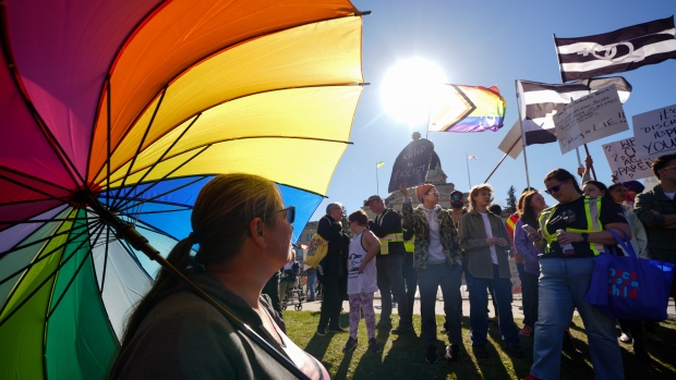 People attend competing rallies in support of, and opposing the Saskatchewan government's proposed legislation on pronoun policy in front of the Saskatchewan Legislative Building in Regina, Tuesday, Oct. 10, 2023. THE CANADIAN PRESS/Heywood Yu