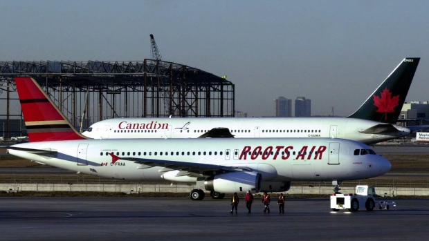 A Roots Air plane taxis out for the airline's first flight from Pearson International Airport in Toronto Monday March 26, 2001. (CP PHOTO/Aaron Harris)