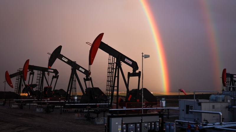 A rainbow appears to come down on pumpjacks drawing out oil and gas from wells near Calgary, Alta., Monday, Sept. 18, 2023. Canada has the third largest oil reserves in the world and is the world's fourth largest oil producer. THE CANADIAN PRESS/Jeff McIntosh