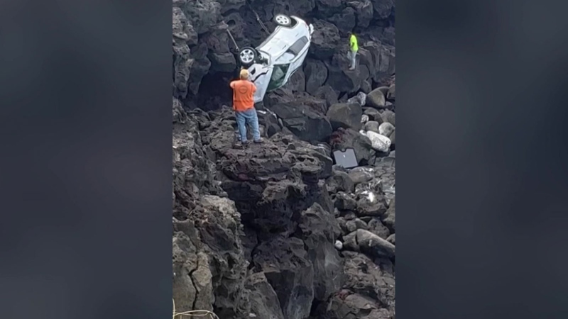 WATCH: Man rescued after driving car off cliff