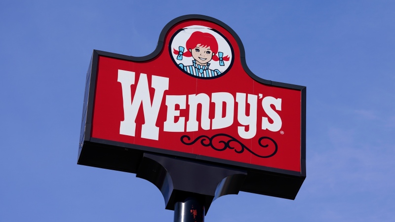 A sign stands over a Wendy's restaurant, Feb. 25, 2021, in Des Moines, Iowa. (AP Photo/Charlie Neibergall, File)