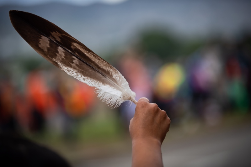 FILE: A woman holds an eagle feather. THE CANADIAN PRESS/Darryl Dyck