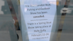 A sign posted on the doors of the Agriplex in London, Ont. as seen on Feb. 26, 2024, indicating the London Boat, Fishing, and Outdoor Show was cancelled. (Gerry Dewan/CTV News London)