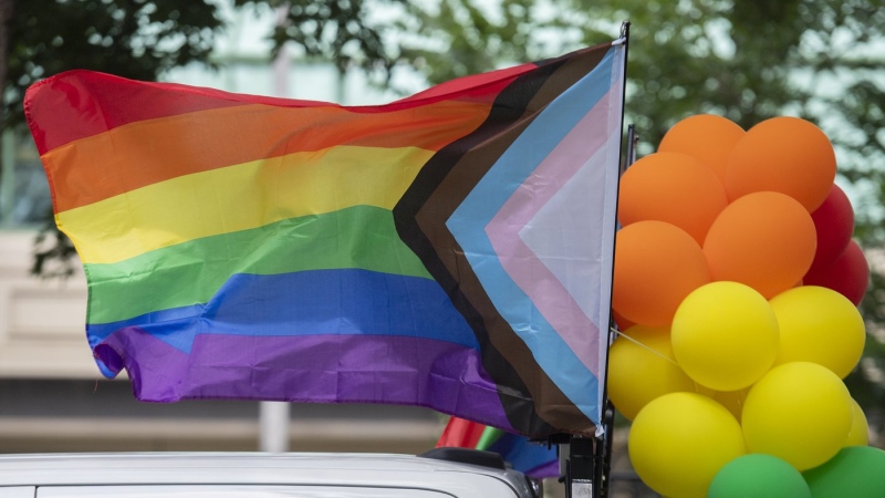 Rainbow flags and coloured balloons are shown at the site where the Montreal Pride parade was supposed to start from in Montreal, Sunday, August 7, 2022. (THE CANADIAN PRESS/Graham Hughes)
