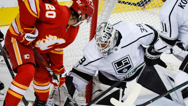 Los Angeles Kings goalie Cam Talbot (39) defends the goal from Calgary Flames forward Blake Coleman (20) during first period NHL hockey action in Calgary, Tuesday, Feb. 27, 2024.THE CANADIAN PRESS/Jeff McIntosh