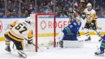 Pittsburgh Penguins' Rickard Rakell (67) scores against Vancouver Canucks goalie Thatcher Demko (35) during the second period of an NHL hockey game in Vancouver, on Tuesday, February 27, 2024. THE CANADIAN PRESS/Darryl Dyck