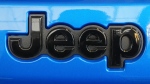 This is the Jeep logo on a Jeep automobile on display at the Pittsburgh International Auto Show in Pittsburgh, Feb. 15, 2024. (AP Photo/Gene J. Puskar)