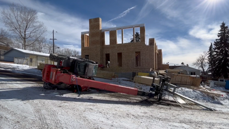 A machine is seen toppled over on its side at a construction site on 22nd Avenue N.W. on Feb. 28, 2024. (CTV News) 