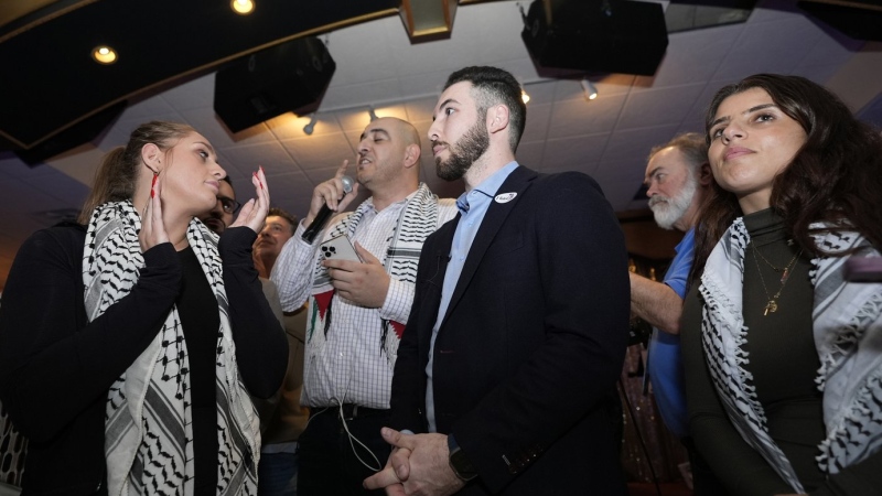 From left; Layla Elabed, Abbas Alawich, Dearborn Mayor Abdullah Hammoud and Lexis Zeidan, listen as Alawich answers a reporter's question during an election night gathering, Tuesday, Feb. 27, 2024, in Dearborn, Mich. Some Democratic voters pledged to vote "uncommitted" in Tuesday's primary to let U.S. President Joe Biden know they aren't happy with his support for Israel in its response to the Oct. 7 attacks by Hamas. (AP Photo/Carlos Osorio)