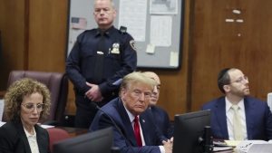 Former U.S. president Donald Trump appears during a court hearing at Manhattan criminal court, Thursday, Feb. 15, 2024, in New York. A New York judge says Trump's hush-money trial will go ahead as scheduled with jury selection starting on March 25. (Brendan McDermid/Pool Photo via AP)