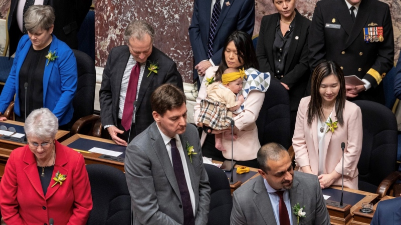 B.C. NDP cabinet minister Bowinn Ma holds her baby Azalea in the provincial legislature. 