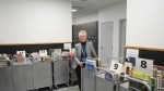 Kim Huntley Area Manager for North York Central Library, is photographed amongst books readied to be returned to the Library's shelves, in Toronto, on Friday February 23, 2024. THE CANADIAN PRESS/Chris Young
