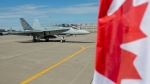 A CF-18 Hornet sits on the tarmac at Canadian Forces Base Trenton, in Trenton, Ont., on June 20, 2022. (Lars Hagberg/Canadian Press)