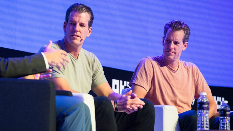 Gemini to pay US$1.1 billion back to customers, seen here, are the Winklevoss twins in Singapore in September 2023. (Joseph Nair / Bloomberg / Getty Images via CNN Newsource)