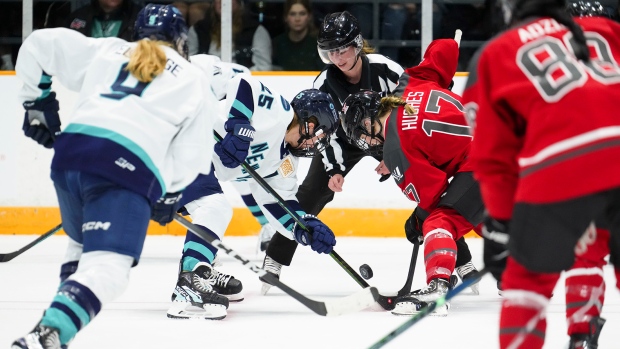 Ottawa's Gabbie Hughes (17) faces off against New York's Alex Carpenter (25) during first period PWHL hockey action in Ottawa on Wednesday, Feb. 28, 2024. (Sean Kilpatrick/THE CANADIAN PRESS) 