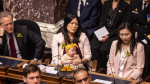 Politician criticized for bringing baby to work