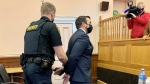 Const. Carl Douglas Snelgrove, centre, of the Royal Newfoundland Constabulary is shown in court in St. John's on Friday Nov. 12, 2021.  THE CANAIDAN PRESS/Sarah Smellie