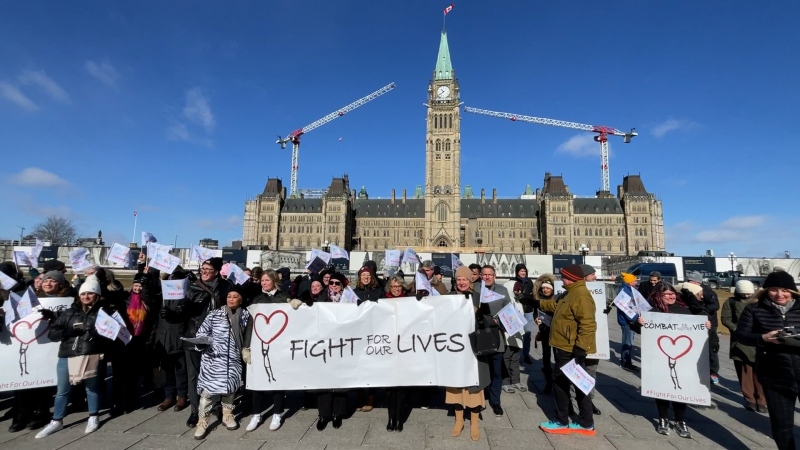 Participants of the Canadian Organization for Rare Disorders summit march on Parliament Hill, Feb. 29, 2024. (Peter Szperling/CTV News Ottawa)