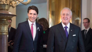 Former prime minister Brian Mulroney arrives with Prime Minister Justin Trudeau to receive the insignia of Commander of the National Order of the Legion of Honour from the Embassy of France, on Tuesday, Dec. 6, 2016 in Ottawa. THE CANADIAN PRESS/Justin Tang