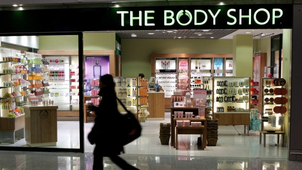 A woman passes a Body Shop cosmetics store at the airport in Frankfurt, central Germany, Friday, March 17, 2006. THE CANADIAN PRESS/AP/Michael Probst