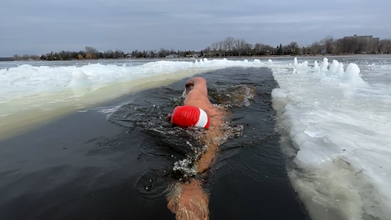 Tom Heyerdahl, 61, carved out a 25-meter ice pool at Britannia Beach and has been swimming in it daily. (Dave Charbonneau/CTV News Ottawa)
