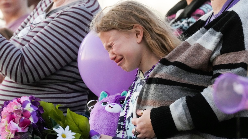 Kristlyn Wood, a cousin of 11-year-old Audrii Cunningham, reacts during a vigil in Cunningham's honor, Wednesday, Feb. 21, 2024, in Livingston, Texas. (Jason Fochtman/Houston Chronicle via AP)