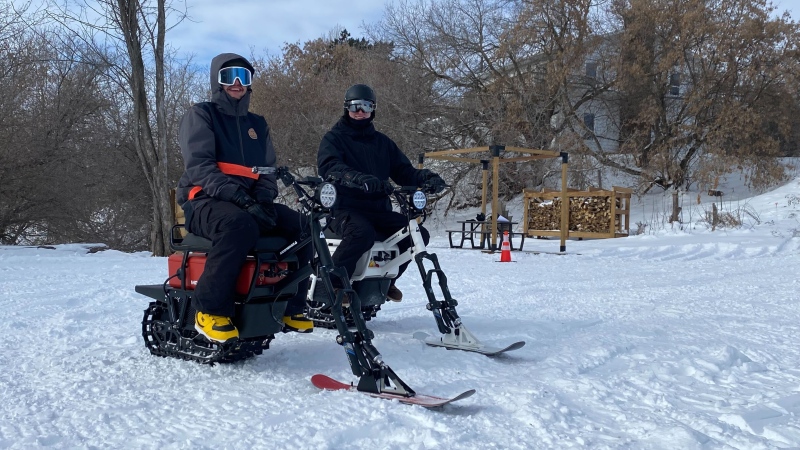 Jack Dorosatnko (right), owner of Rural River Rentals, and his friend Tyler Madsen on Moonbikes in Sturgeon County on March 1, 2024. (Miriam Valdes-Carletti/CTV News Edmonton)