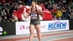 Sarah Mitton, of Canada, celebrates after winning the gold medal in the women's shot put during the World Athletics Indoor Championships at the Emirates Arena in Glasgow, Scotland, Friday, March 1, 2024. (AP Photo/Bernat Armangue)