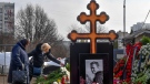 Russian opposition leader Alexei Navalny's mother, Lyudmila Navalnaya, left, and his mother-in-law, no name available, visit the grave of Alexei Navalny after his yesterday funeral at the Borisovskoye Cemetery, in Moscow, Russia, on Saturday, March 2, 2024. Navalny, who was President Vladimir Putin's fiercest foe, was buried after a funeral that drew thousands of mourners amid a heavy police presence. (AP Photo)