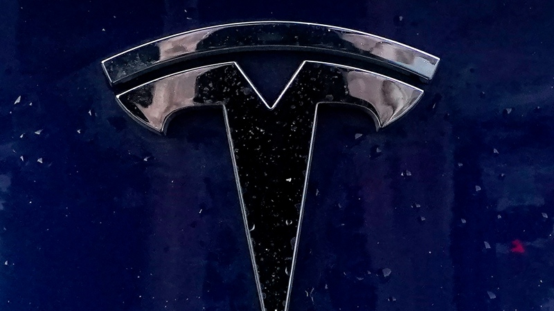 A Tesla electric vehicle emblem is affixed to a passenger vehicle Sunday, Feb. 21, 2021, in Boston. The lawyers who successfully argued that a massive pay package for Tesla CEO Elon Musk was illegal and should be voided have asked the presiding judge to award them company stock worth US$5.6 billion as legal fees. The attorneys, who represented Tesla shareholders in the case decided in January, made the request of the Delaware judge in court papers filed Friday, March 1, 2024. (AP Photo/Steven Senne)