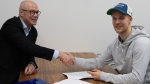 Canucks forward Elias Pettersson and general manager Patrik Allvin shake hands as Pettersson prepares to sign his new, eight-year contract extension with the team on Saturday, March 2, 2024. (Photo: Vancouver Canucks)