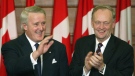 Prime Minister Jean Chretien applauds former prime minister Brian Mulroney during an official unveiling ceremony of Mulroney's official portrait on Parliament Hill in Ottawa Tuesday Nov 19, 2002. THE CANADIAN PRESS/Tom Hanson 