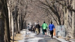 People enjoy the mild temperatures as they walk through Lafontaine Park Tuesday, February 27, 2024 in Montreal.THE CANADIAN PRESS/Ryan Remiorz